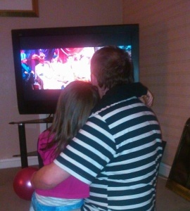 A sly photo, taken by my wife, of my daughter and I watching Gentlemen Prefer Blondes.